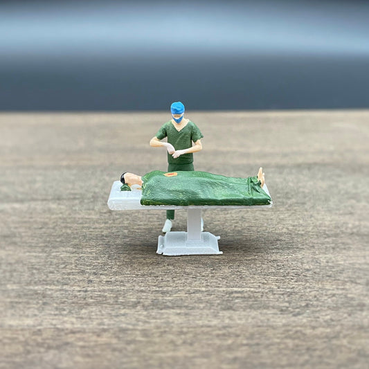 Surgeon Performing Surgery with Patient. Miniature Human Figures. 1:64 Scale