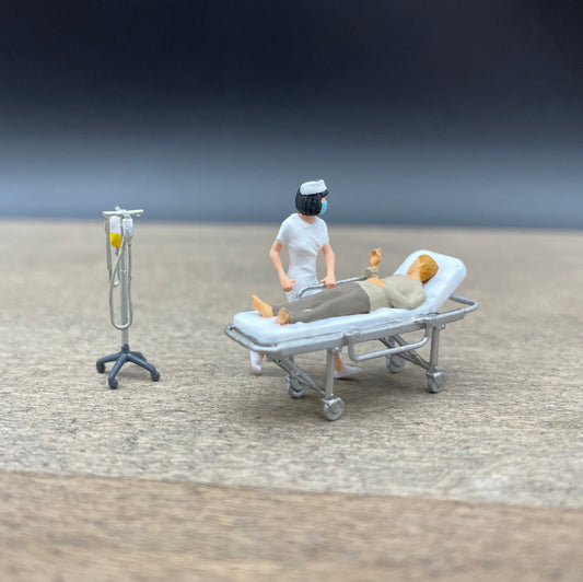 Nurse with Patient on Stretcher and IV. Miniature 1:64 Scale Model